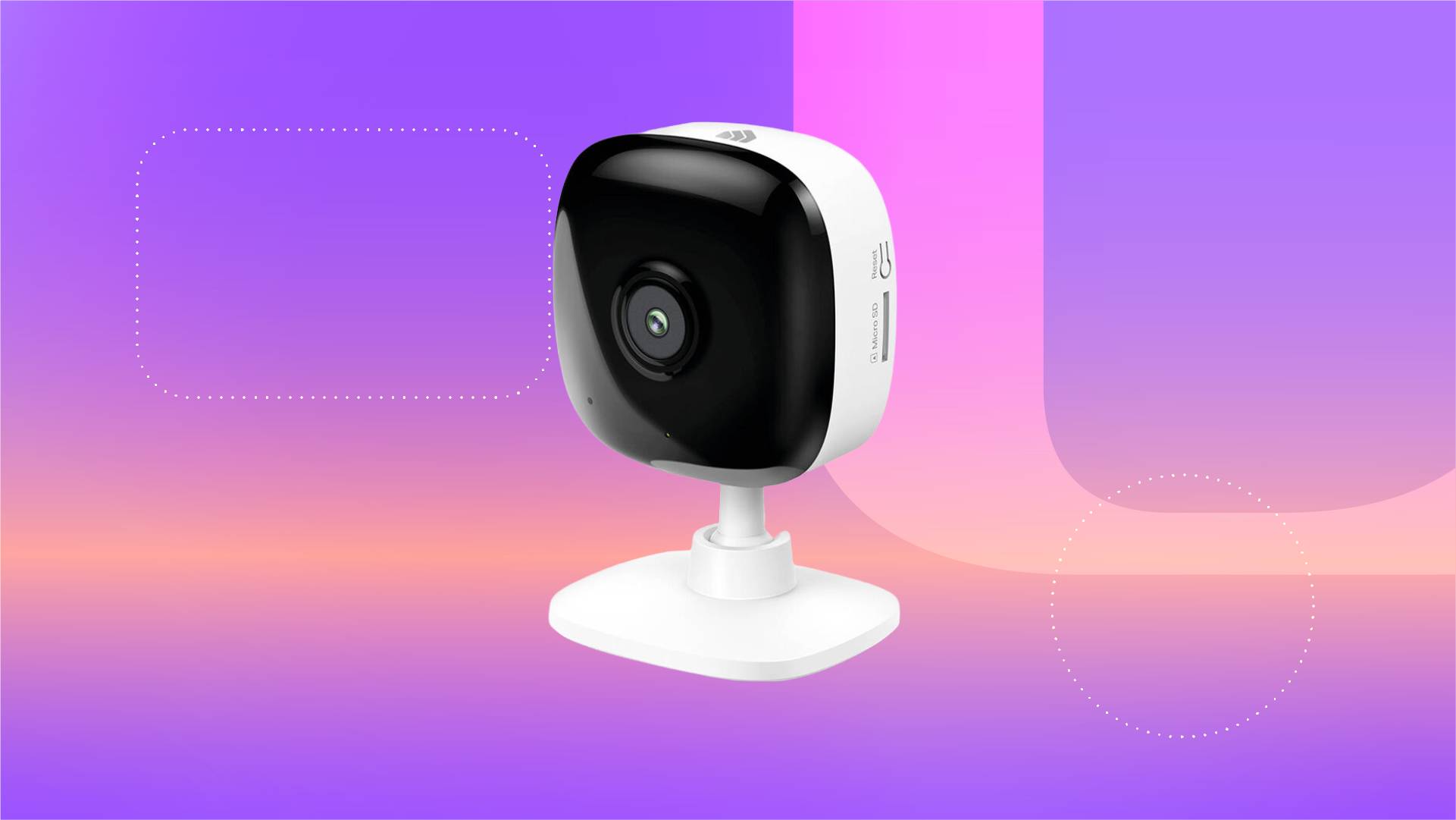 A white indoor security camera against a purple gradient CNET background.
