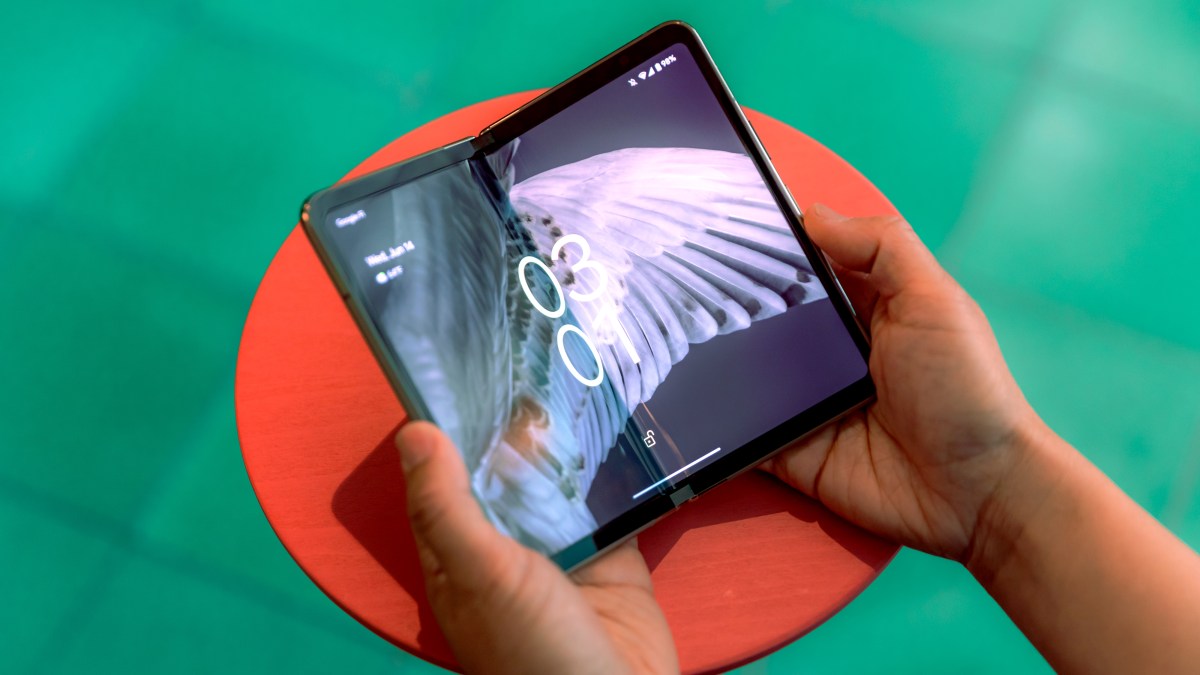 Hands holding Google's Pixel Fold phone