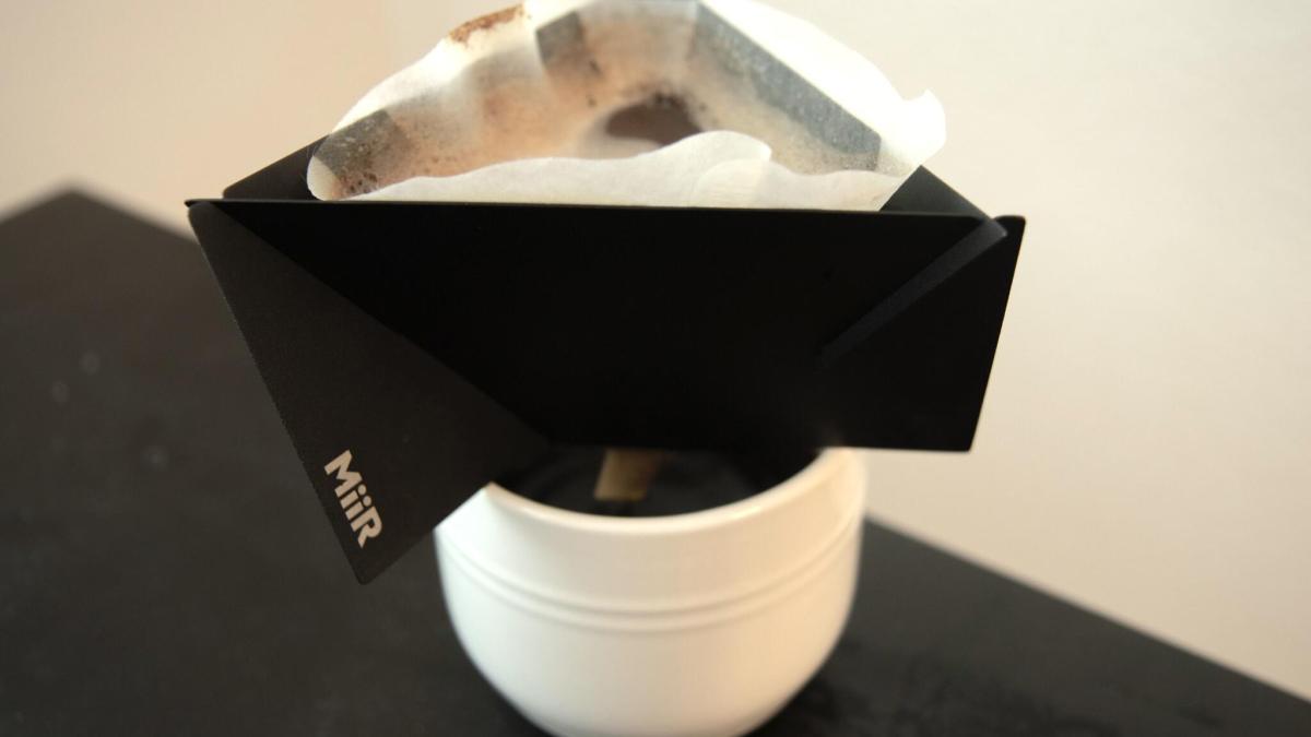 pouragami coffee maker on top of mug