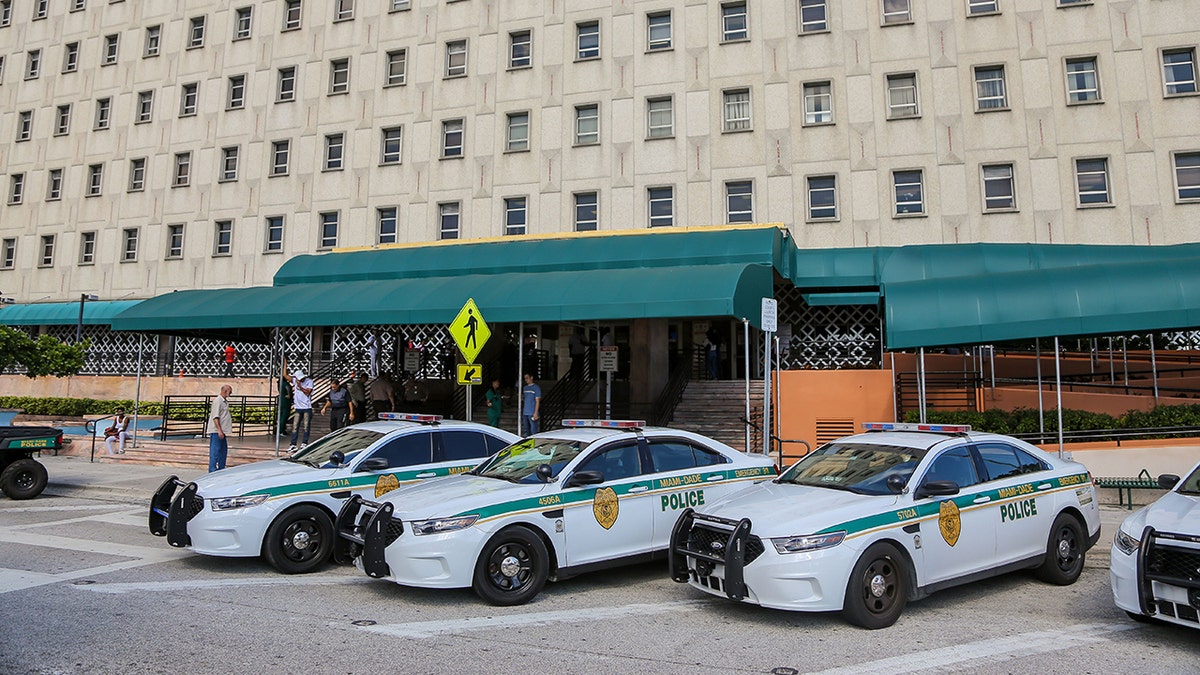 Police cars are seen outside the Miami-Dade County courthouse in Miami, Florida on November 8, 2019.