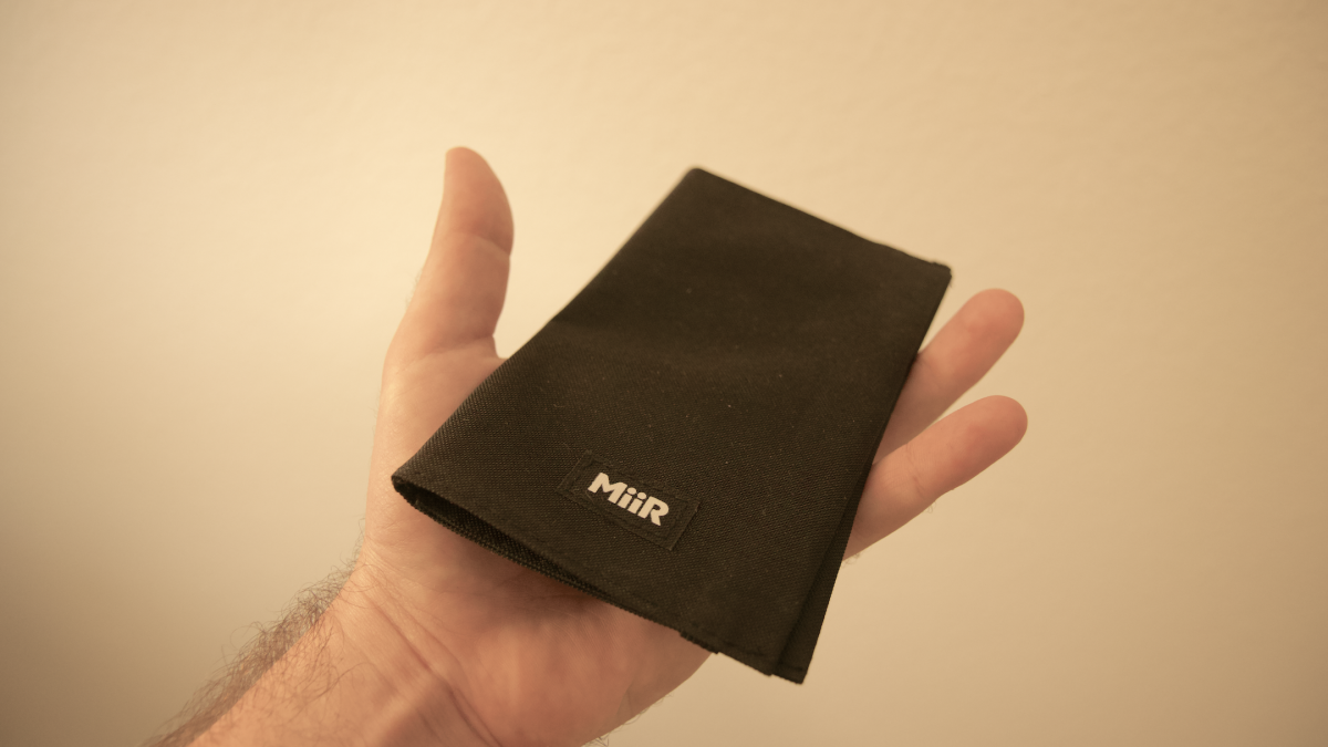 hand holding folded pouragami coffee maker