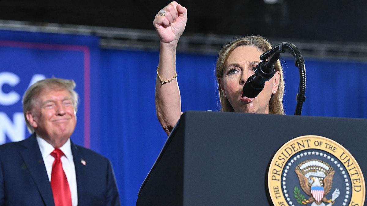 President Donald Trump listens to US Senator Darline Graham speak during a campaign rally at Myrtle Beach Convention Center in Myrtle Beach, South Carolina on August 21, 2026.