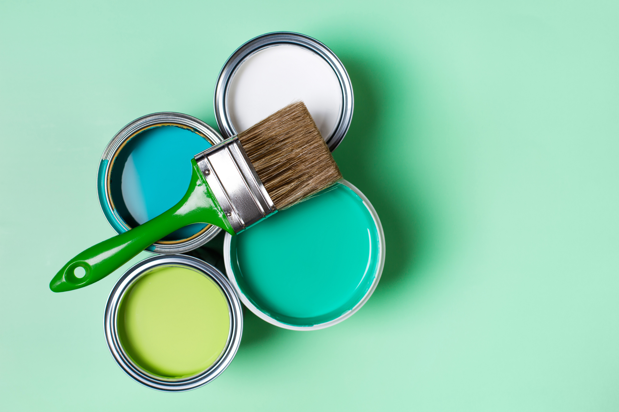 Different pots of paint including white and blue