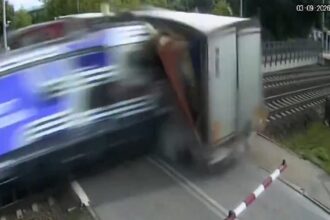Driver of lorry hit by Polish train refused to break through barriers