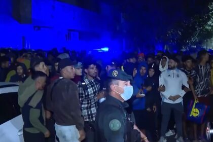 Police fire shots in the air as migrants moved to new Ceuta facility