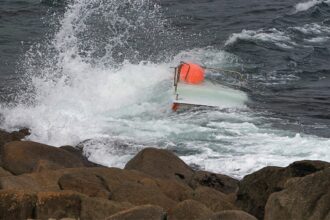 Teen boater found clinging to capsized vessel after 3 go missing; 2 bodies recovered