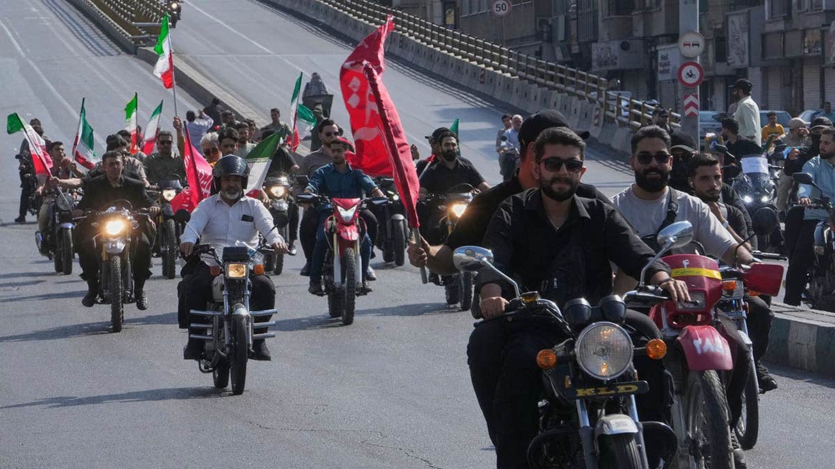 Motorcyclists ride during a state-organized motorcycle parade called