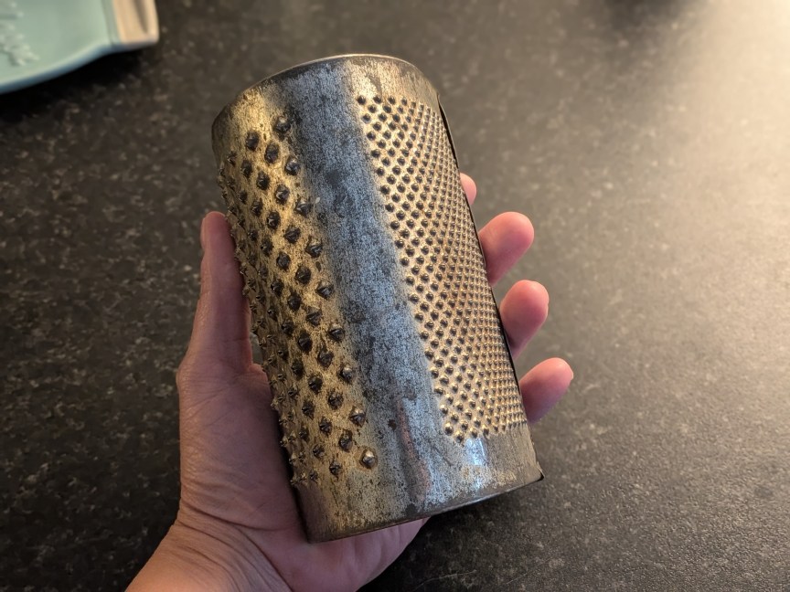 box grater held in hand