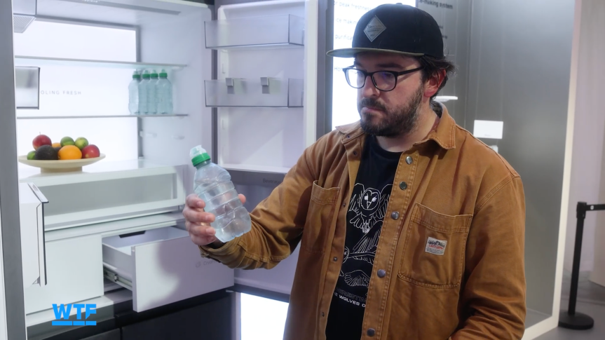 The writer looking confused at a water bottle that has come out of an extremely cold fridge showcased at IFA.