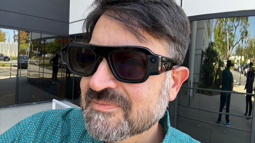 Scott Stein wearing Snap Specs AR glasses with sunglasses mode on