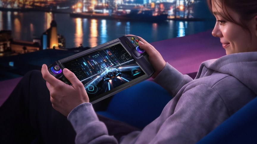 Woman playing on acer project dualplay mini in handheld mode with a night cityscape in the background