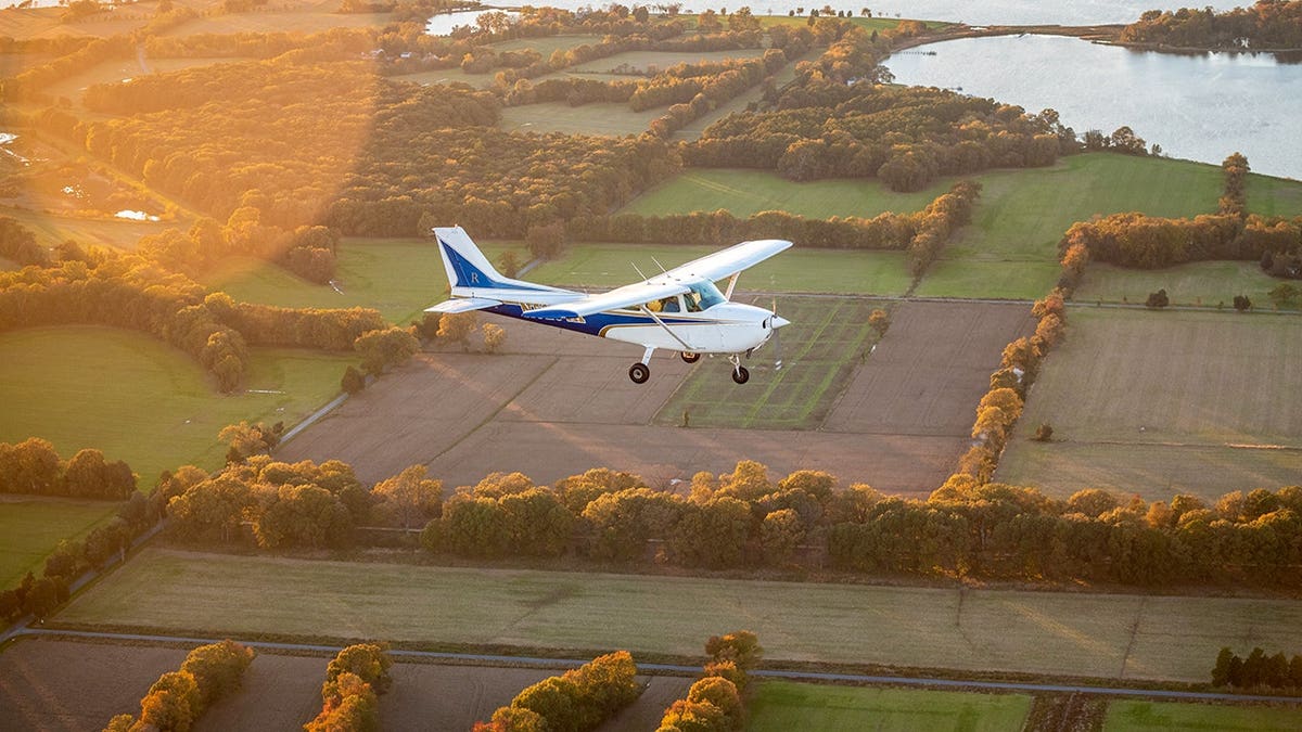 Cessna 172 airplane in flight.