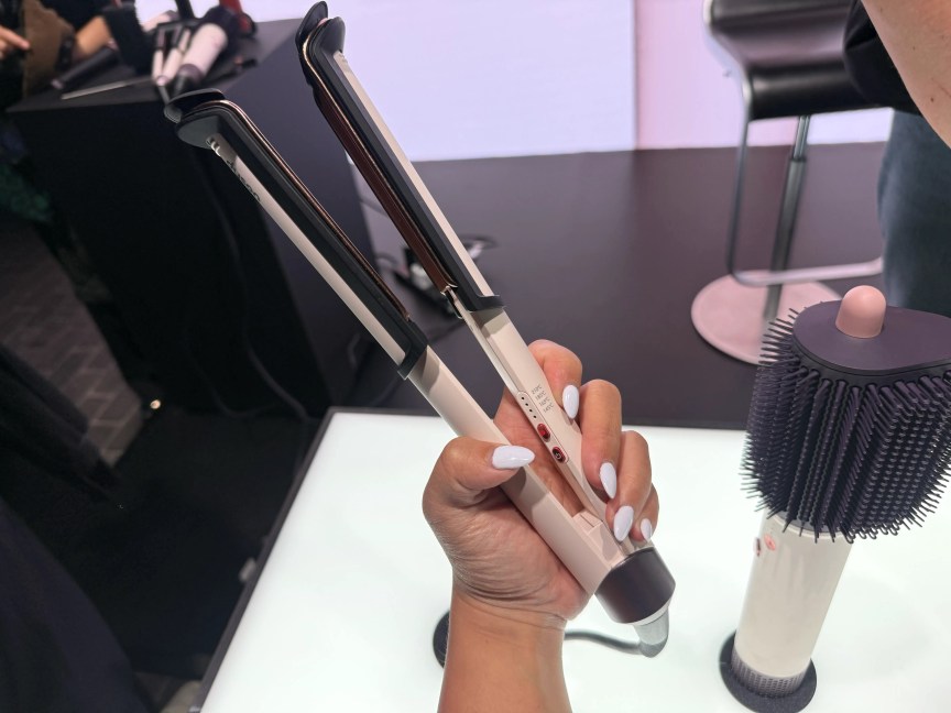 The pink Dyson Corrale CoolShine straightener.