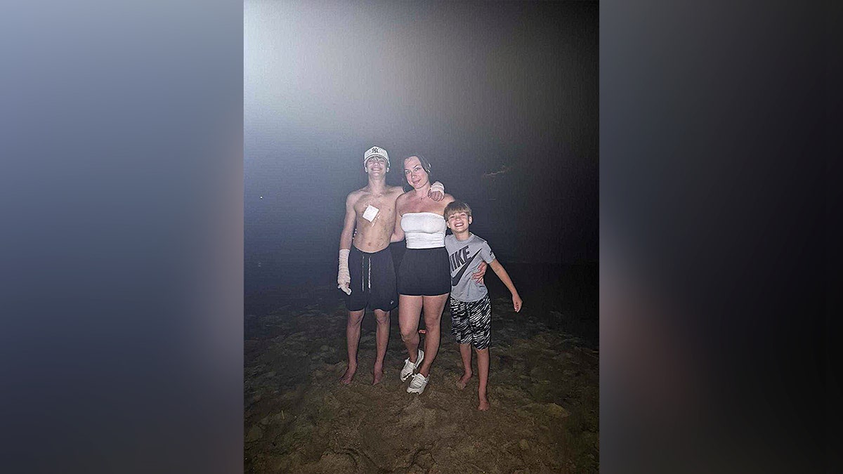 mom hugging her two sons