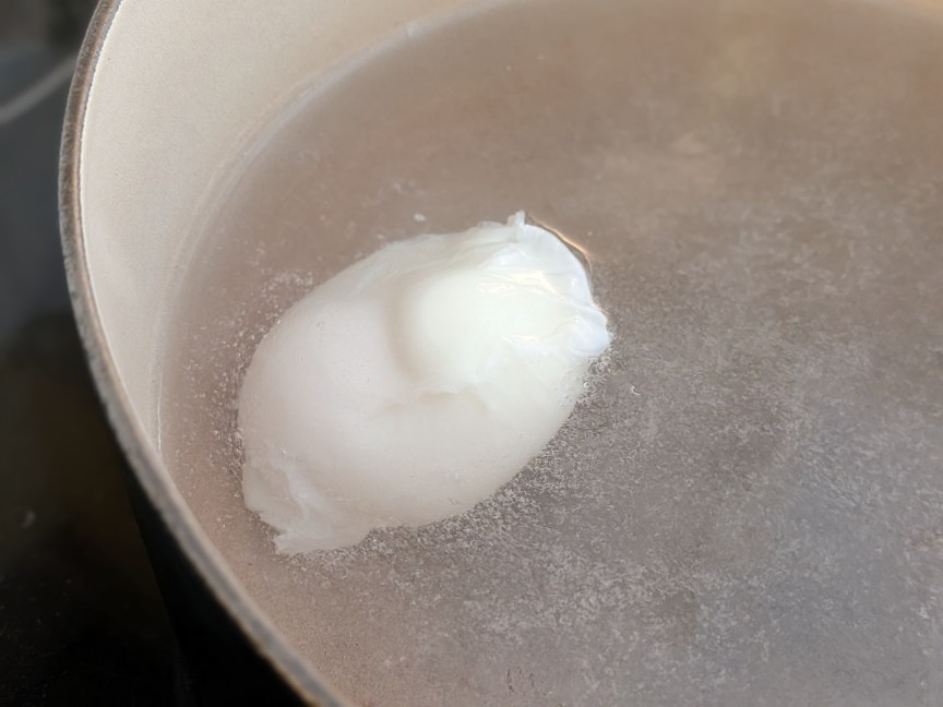 strained egg simmering like a tidy package